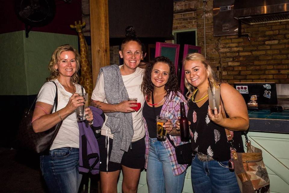 Group on a Booze and Boos adventure with their Austin tour guide